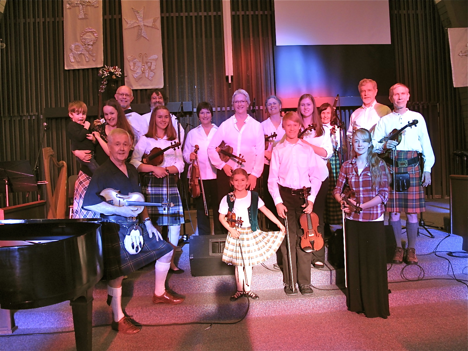 Group shot before the concert with sunshine pouring through the stained glass windows to give us some "unique" skin tones!